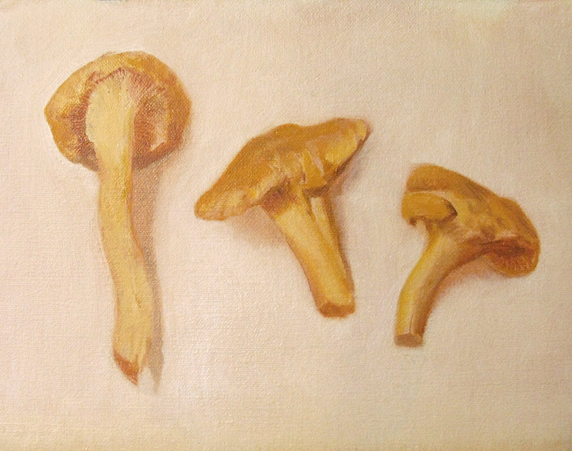 three chanterelle mushrooms